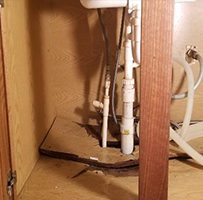 Water Damaged Sink Base Cabinet Floor, How To Repair Water Damaged Cabinet Under Sink